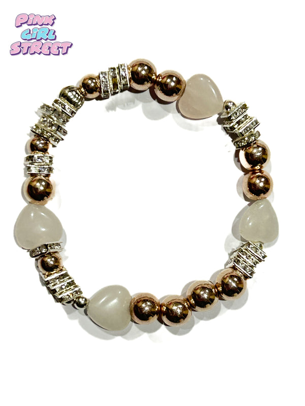 Heart bracelet it’s a a stylish Jeans Bracelet with rose quartz hearts and square spacer beads with golden balls